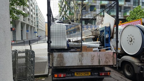 Recycling center processing old furniture in Sutton